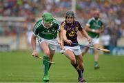27 July 2014; SŽamus Hickey, Limerick, in action against Liam îg McGovern, Wexford. GAA Hurling All Ireland Senior Championship Quarter-Final, Limerick v Wexford. Semple Stadium, Thurles, Co. Tipperary. Picture credit: Dáire Brennan / SPORTSFILE