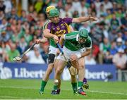27 July 2014; Niall Moran, right, and David Breen, Limerick, in action against Richie Kehoe, Wexford. GAA Hurling All Ireland Senior Championship Quarter-Final, Limerick v Wexford. Semple Stadium, Thurles, Co. Tipperary. Picture credit: Dáire Brennan / SPORTSFILE