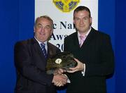 15 July 2006; Damian Lawlor, from Tipperary, and of the Sunday Independent receives his GAA MacNamee award for &quot;Best Article in a National or Provincial Newspaper&quot; from GAA President Nickey Brennan at the 2006 GAA MacNamee awards. Burlington Hotel, Dublin. Picture credit: Brendan Moran / SPORTSFILE
