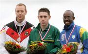4 September 2006; Ireland's Jason Smyth stands on the podium with his Gold Medal after winning the Men's 100m T13 (visually impaired) Final. Also pictured are Silver medallist Matthias Schroeder, left, of Germany and bronze medallist Andre Andrade, of Brazil. Paralympic World Athletics Championships, Assen, Holland. Picture credit; SPORTSFILE