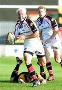 9 September 2006; Paddy Wallace, Ulster, makes a break escaping the clutches of Ceri Sweeney, Newport Gwent Dragons. Magners Celtic League 2006 - 2007, Newport Gwent Dragons v Ulster, Rodney Parade, Newport, Gwent, Wales. Picture credit: Tim Parfitt / SPORTSFILE