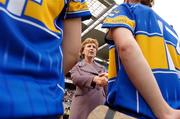 10 September 2006; President Mary McAleese shakes hands with Eimear McDonnell, Tipperary, before the start of the game, as she is introducted to the two team's. Gala All-Ireland Senior Camogie Championship, Final, Cork v Tipperary, Croke Park, Dublin. Picture credit: David Maher / SPORTSFILE