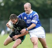 10 September 2006; James Duffy, Killeavy, in action against Barry O'Hagan, Clan na Gael . Armagh Senior Football Championship Semi-Final, Clan na Gael v Killeavy, Abbey Park, Armagh City, Co. Armagh. Picture credit: Oliver McVeigh / SPORTSFILE