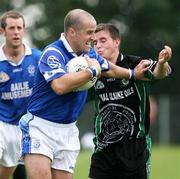 10 September 2006; Barry O'Hagan, Clan na Gael, in action against James Duffy, Killeavy. Armagh Senior Football Championship Semi-Final, Clan na Gael v Killeavy, Abbey Park, Armagh City, Co. Armagh. Picture credit: Oliver McVeigh / SPORTSFILE