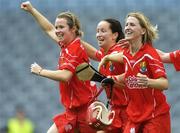 10 September 2006; Cork players, left to right, Elaine Burke, Una O'Donoghue and Mary O'Connor, celebrate at the end of the game. Gala All-Ireland Senior Camogie Championship, Final, Cork v Tipperary, Croke Park, Dublin. Picture credit: David Maher / SPORTSFILE