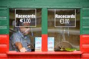 29 July 2014; A general view of a racecard seller waiting for racegoers to arrive of the day's races. Galway Racing Festival, Ballybrit, Co. Galway. Picture credit: Barry Cregg / SPORTSFILE