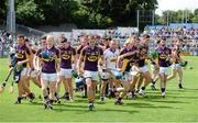 27 July 2014; The Wexford squad break away after the traditional team photograph before the game. GAA Hurling All Ireland Senior Championship Quarter-Final, Limerick v Wexford. Semple Stadium, Thurles, Co. Tipperary. Picture credit: Diarmuid Greene / SPORTSFILE
