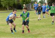 30 July 2014; Darragh Priestley, left, aged 11, from Kildare Town, in action against Cameron Byrne, aged 11, from London, during the The Herald Leinster Rugby Summer Camps in Cill Dara RFC, Co. Kildare. Picture credit: Piaras Ó Mídheach / SPORTSFILE