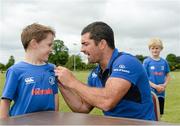 30 July 2014; Joshua Scanlon, aged, 7, from Monasterevin, Co. Kildare, has his shirt signed by Leinster and Ireland rugby player Rob Kearney during the The Herald Leinster Rugby Summer Camps in Cill Dara RFC, Co. Kildare. Picture credit: Piaras Ó Mídheach / SPORTSFILE