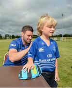 30 July 2014; John Conlon, aged 8, from Rathangan, Co. Kildare, has his jersey signed by Leinster and Ireland rugby player Fergus McFadden during the The Herald Leinster Rugby Summer Camps in Cill Dara RFC, Co. Kildare. Picture credit: Piaras Ó Mídheach / SPORTSFILE