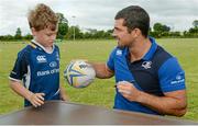 30 July 2014; Thomas Costello, aged 8, from Naas Rugby club, with Leinster and Ireland rugby player Rob Kearney during the The Herald Leinster Rugby Summer Camps in Cill Dara RFC, Co. Kildare. Picture credit: Piaras Ó Mídheach / SPORTSFILE