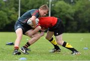 30 July 2014; Paddy Kelleher, left, from Cork, is tackled by Ethan Baxter, from Greystones, Co. Wicklow, during a Leinster School of Excellence Camp. The King's Hospital, Palmerstown, Dublin. Picture credit: Brendan Moran / SPORTSFILE