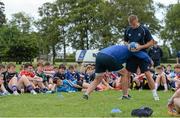 30 July 2014; Coaches Will Matthews, right, and Ben Armstrong demonstrate tackling to participants during a Leinster School of Excellence Camp. The King's Hospital, Palmerstown, Dublin. Picture credit: Brendan Moran / SPORTSFILE