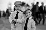 30 July 2014; (Editors please note; This black & white image has been created from an original colour file) Enjoying a day at the races are Cody Kenny, left, age 4, and his brother Reece, age 2, from Blueball, Co. Offaly. Galway Racing Festival, Ballybrit, Co. Galway. Picture credit: Barry Cregg / SPORTSFILE