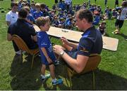 30 July 2014; Leinster's Devon Toner signs autographs during the The Herald Leinster Rugby Summer Camps in Wanderers FC, Merrion Road, Co. Dublin. Picture credit: Dáire Brennan / SPORTSFILE