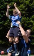 30 July 2014; Leinster's Devon Toner lifts Luke Schmidt, son of Ireland head coach Joe, during the The Herald Leinster Rugby Summer Camps in Wanderers FC, Merrion Road, Co. Dublin. Picture credit: Dáire Brennan / SPORTSFILE