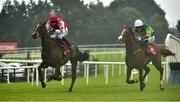 30 July 2014; Most Peculiar, left, with Paul Townend up, pulls away from Draco, with Tony McCoy up, who finished second, as they race towards the finishing post, on their way to winning the €100,000 Tote Pick6 Guarantee Maiden Hurdle. Galway Racing Festival, Ballybrit, Co. Galway. Picture credit: Barry Cregg / SPORTSFILE