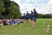 30 July 2014; Leinster Academy players Garry Ringrose, centre, and Nick McCarthy, right, in the company of coach Ben Armstrong, speak to participants during a Leinster School of Excellence Camp. The King's Hospital, Palmerstown, Dublin. Picture credit: Brendan Moran / SPORTSFILE