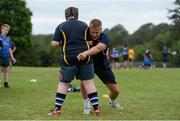 30 July 2014; Coach Will Matthews demonstrates tackle technique to participants during a Leinster School of Excellence Camp. The King's Hospital, Palmerstown, Dublin. Picture credit: Brendan Moran / SPORTSFILE