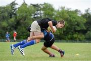 30 July 2014; Caoilim Fassbender, from Dun Laoghaire, Dublin, is tackled by Mark Nicholson, from Wicklow Town, during a Leinster School of Excellence Camp. The King's Hospital, Palmerstown, Dublin. Picture credit: Brendan Moran / SPORTSFILE