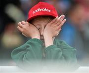 30 July 2014; A dejected James Desmond, aged 9, from Passage West, Co. Cork, after his horse Golden Ticket, with Tony McCoy, looses by a half a length to Greatness, with Shane Shortall up. Galway Racing Festival, Ballybrit, Co. Galway. Picture credit: Barry Cregg / SPORTSFILE