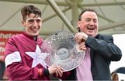 30 July 2014; Jockey Shane Shortall holds up the Galway Plate with his father Sean after he rode Road to Riches to win thetote.com Galway Plate. Galway Racing Festival, Ballybrit, Co. Galway. Picture credit: Barry Cregg / SPORTSFILE