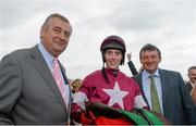 30 July 2014; Jockey Shane Shortall in the winners enclosure with trainer Noel Meade, left, and Eddie O'Leary brother of owner Michael O'Leary, after he rode Road to Riches to win thetote.com Galway Plate. Galway Racing Festival, Ballybrit, Co. Galway. Picture credit: Barry Cregg / SPORTSFILE