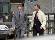 30 July 2014; Republic of Ireland manager Martin O'Neill, left, and his friend Justin Carthy, Head of Racecource Management for Ladbrokes and owner of Break My Mind, return to the parade ring after Mr Carthy's horse had fallen in the Grab A Grand With Tote Maiden. Galway Racing Festival, Ballybrit, Co. Galway. Picture credit: Ray McManus / SPORTSFILE