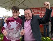 30 July 2014; Jockey Shane Shortall holds up the Galway Plate with his father Sean after he rode Road to Riches to win thetote.com Galway Plate. Galway Racing Festival, Ballybrit, Co. Galway. Picture credit: Ray McManus / SPORTSFILE