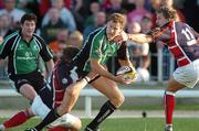 15 September 2006; Matt Mostyn, Connacht, is tackled by Mathew Watkins and Darren Daniel, Llanelli Scarlets. Magners Celtic League 2006 - 2007, Connacht v Llanelli. Picture credit; Ray Ryan / SPORTSFILE