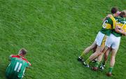 17 September 2006; A dejected Ger Brady, 11, Mayo, as Kerry players left to right, Killian Young, Seamus Moynihan and Ronan Hussey celebrate at the end of the game. Bank of Ireland All-Ireland Senior Football Championship Final, Kerry v Mayo, Croke Park, Dublin. Picture credit: David Maher / SPORTSFILE