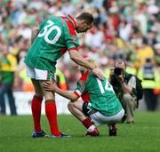 17 September 2006; Mayo's David Brady consoles his team-mate Conor Mortimer  after the final whistle. Bank of Ireland All-Ireland Senior Football Championship Final, Kerry v Mayo, Croke Park, Dublin. Picture credit: Oliver McVeigh / SPORTSFILE