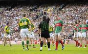17 September 2006; David Brady, Mayo, and Kieran Donaghy, Kerry, are shown the yellow card by referee Brian Crowe. Bank of Ireland All-Ireland Senior Football Championship Final, Kerry v Mayo, Croke Park, Dublin. Picture credit: Ray McManus / SPORTSFILE