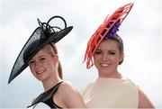 31 July 2014; Carolin Hilker, left, from Bielefeld, Germany, and Laura Gibson, from Mullingar, Co. Westmeath, enjoying a day at the races. Galway Racing Festival, Ballybrit, Co. Galway. Picture credit: Barry Cregg / SPORTSFILE