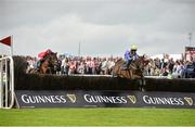 31 July 2014; Alelchi Inois, with Paul Townend up, jumps the sixth ahead of Starkie, with Andrew McNamara up, on their way to winning the Guinness Harp Novice Steeplechase. Galway Racing Festival, Ballybrit, Co. Galway. Picture credit: Barry Cregg / SPORTSFILE