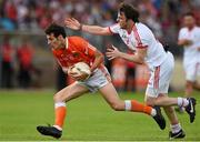 13 July 2014; Jamie Clarke, Armagh, in action against Barry Tierney, Tyrone. GAA Football All-Ireland Senior Championship Round 2B, Tyrone v Armagh, Healy Park, Omagh, Co. Tyrone. Picture credit: Ramsey Cardy / SPORTSFILE