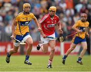 30 July 2014; Peter Duggan, Clare, in action against Darragh Brosnan, Cork. Bord Gais Energy Munster GAA Hurling Under 21 Championship Final, Cork v Clare. Cusack Park, Ennis, Co. Clare. Picture credit: Stephen McCarthy / SPORTSFILE