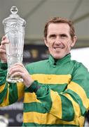 31 July 2014; Jockey Tony McCoy holds up the winning trophy after rode Thomas Edison to victory in the Guinness Galway Hurdle Handicap. Galway Racing Festival, Ballybrit, Co. Galway. Picture credit: Barry Cregg / SPORTSFILE