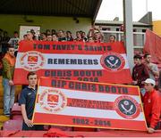 1 August 2014; St Patrick's Athletic supporters display banners in memory of Chris Booth, Sheffield United and St Patrick's Athletic supporter, who died recently, during a minute's applause before the game. SSE Airtricity League Premier Division, St Patrick's Athletic v Sligo Rovers, Richmond Park, Dublin. Picture credit: Piaras Ó Mídheach / SPORTSFILE
