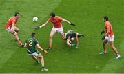 2 August 2014; Aaron Findon, centre, Armagh, passes the ball to team-mate Tony Kernan, left, with support from Stefan Campbell, right, in action against Shane O'Rourke, centre, and Andrew Tormey, left, Meath. GAA Football All-Ireland Senior Championship, Round 4B, Meath v Armagh, Croke Park, Dublin. Picture credit: Barry Cregg / SPORTSFILE