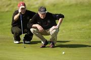 15 September 2006; Eugene McGuigan, left, and his partner Frank McDonnell, Castlebyaney G.C., line up a putt on the eight green during the Bulmers Pierce Purcell Shield Final. Bulmers Cups and Shields Finals 2006, Enniscrone Golf Club, Enniscrone, Sligo. Picture credit: Ray McManus / SPORTSFILE
