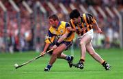 15 August 1999; Alan Markham of Clare is tackled by Philip Larkin of Kilkenny during the Guinness All-Ireland Senior Hurling Championship Semi-Final match between Kilkenny and Clare at Croke Park in Dublin. Photo by Ray McManus/Sportsfile