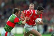 22 August 1999; Bernard Collins of Cork in action against Paraic Kelly of Mayo during the All-Ireland Minor Football Championship Semi-Final match between Cork and Mayo at Croke Park in Dublin. Photo by Aoife Rice/Sportsfile