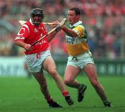 8 August 1999; Brian Corcoran of Cork in action against John Ryan of Offaly during the Guinness All-Ireland Senior Hurling Championship Semi-Final match between Cork and Offaly at Croke Park in Dublin. Photo by Brendan Moran/Sportsfile