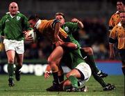 19 June 1999; Chris Latham of Australia in action against Justin Bishop and David Humphreys of Ireland during the Ireland Rugby tour to Australia Second Test match between Australia and Ireland at the Subiaco Oval in Perth, Australia. Photo by Matt Browne/Sportsfile