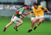 4 September 1999; Christina Heffernan of Mayo in action against Ann Marie Dennehy of Meath during the All-Ireland Senior Ladies Football Championship Semi-Final between Mayo and Meath at Parnell Park in Dublin. Photo by Ray Lohan/Sportsfile
