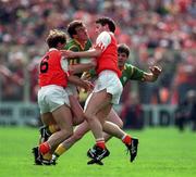 1 May 1994; Colm O'Rourke of Meath is tackled by Kieran McGeeney, 6, and Jarlath Burns, right, of Armagh during the Church & General National Football League Final between Armagh and Meath at Croke Park in Dublin. Photo by Ray McManus/Sportsfile