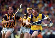 15 August 1999; Conor Clancy of Clare in action against Canice Brennan and Andy Comerford, left, of Kilkenny during the Guinness All-Ireland Senior Hurling Championship Semi-Final match between Kilkenny and Clare at Croke Park in Dublin. Photo by Brendan Moran/Sportsfile
