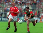 22 August 1999; Conor Moran of Mayo in action against Conrad Murphy of Cork during the All-Ireland Minor Football Championship Semi-Final match between Cork and Mayo at Croke Park in Dublin. Photo by Matt Browne/Sportsfile