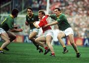 16 September 1990; Teddy McCarthy of Cork in action against Brian Stafford, right, and PJ Gillic of Meath during the All-Ireland Senior Football Championship Final between Cork and Meath at Croke Park in Dublin. Photo by Ray McManus/Sportsfile
